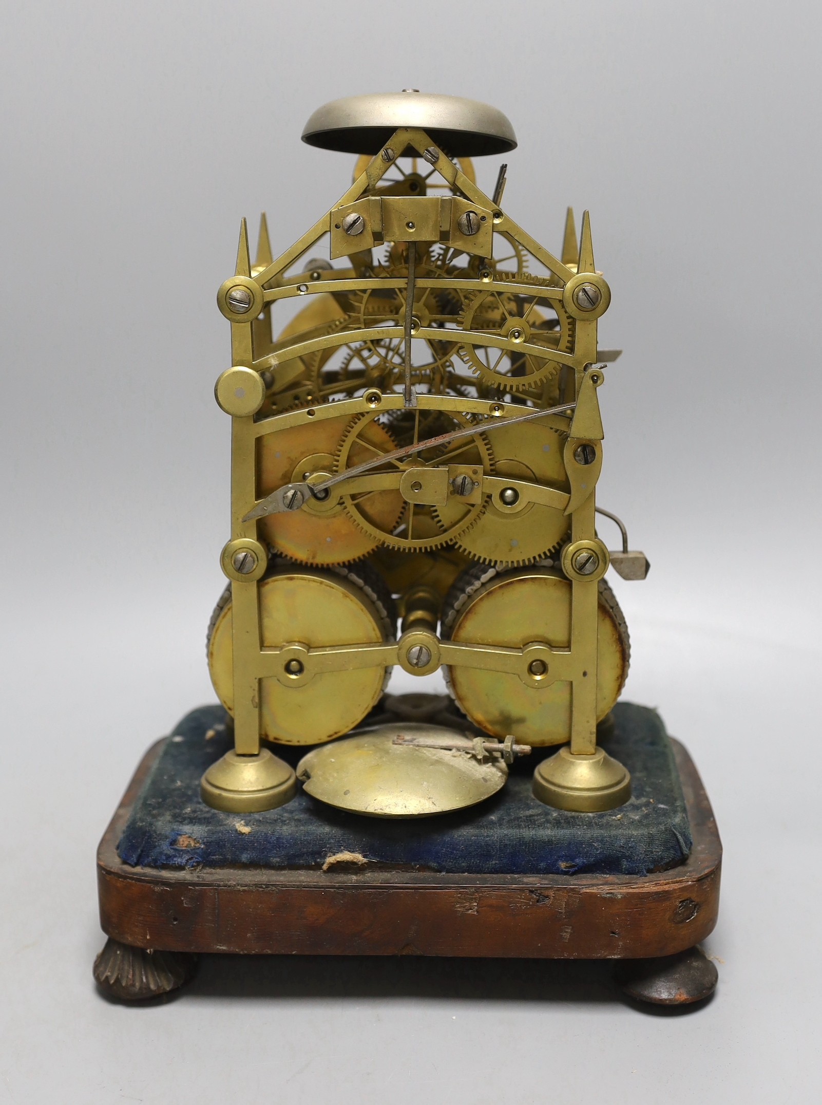 A 19th century brass twin fusee skeleton clock in perspex case with key and pendulum